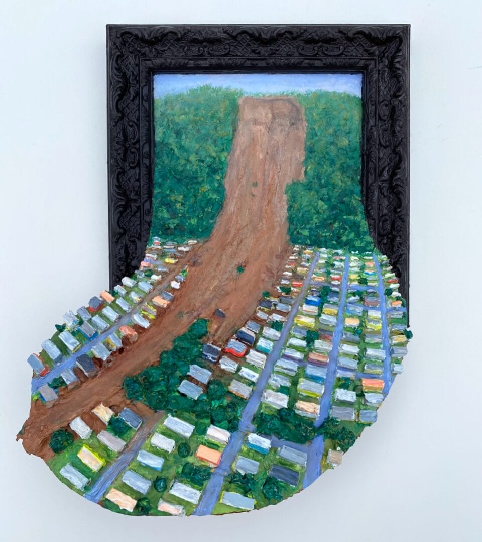 a miniature painting depicting a landscape spilling out of the ornate frame