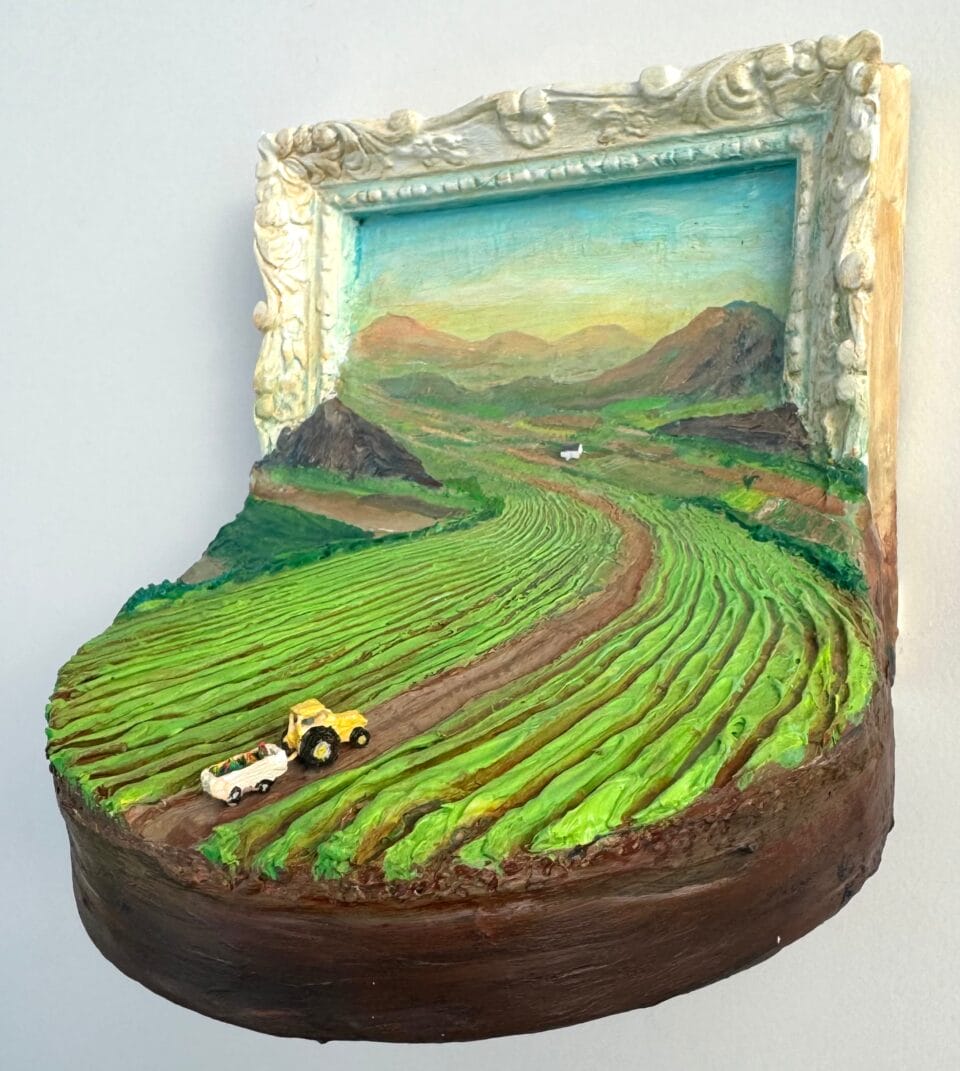 a miniature painting depicting a farm landscape spilling out of the ornate frame