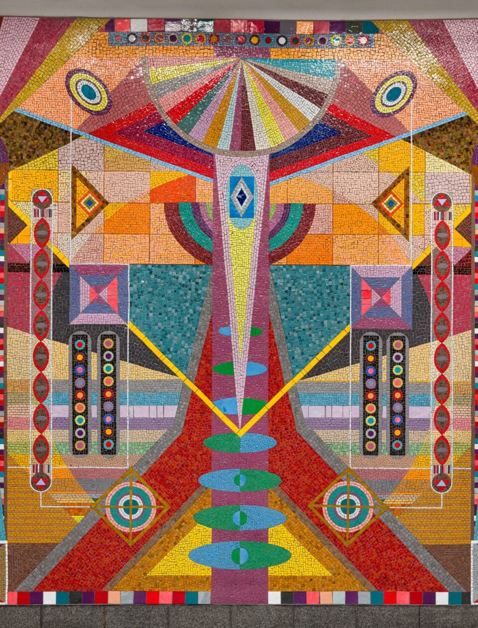 detail of a vibrant geometric mural made of mosaic