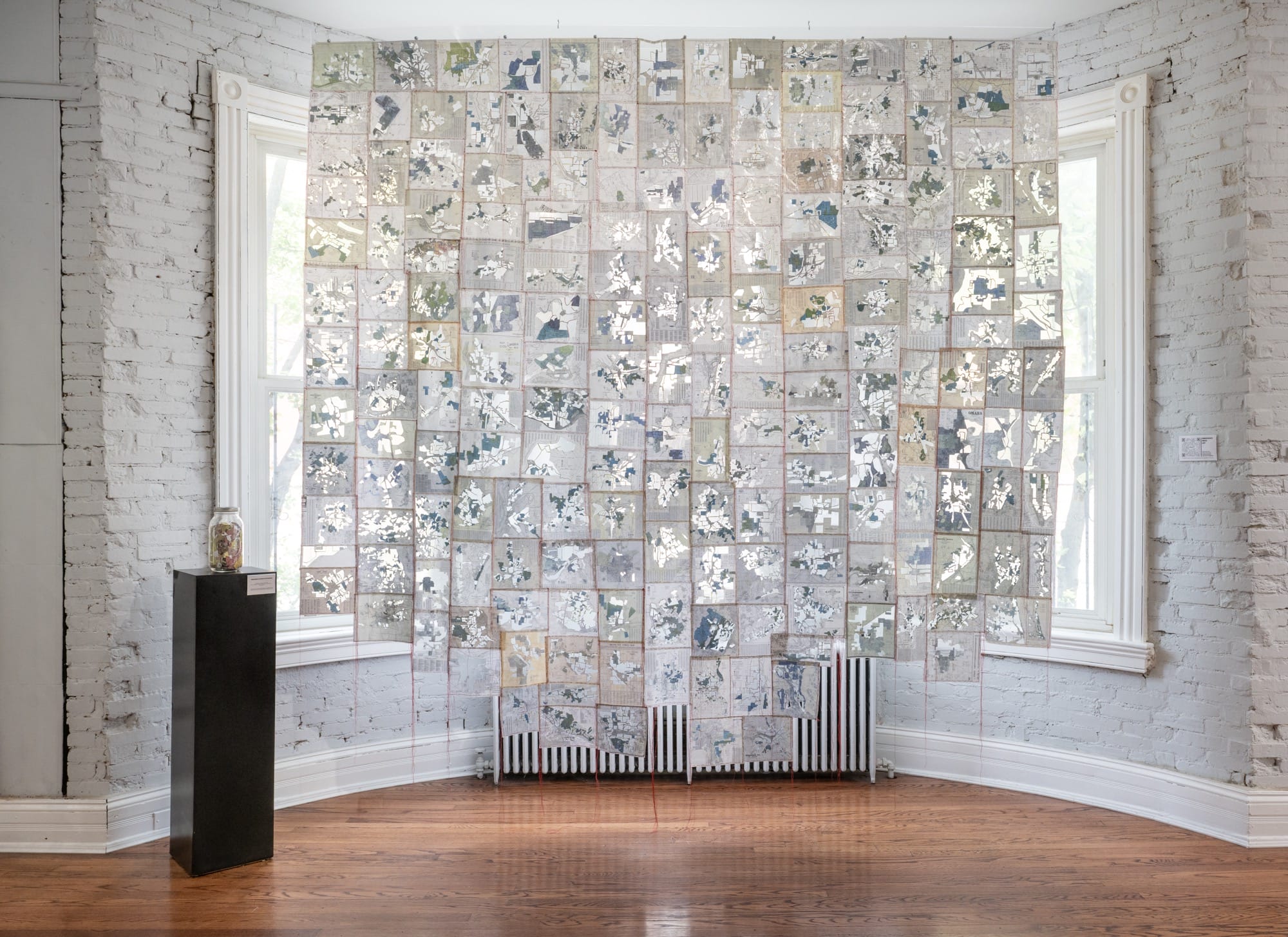 a tapestry in front of a window