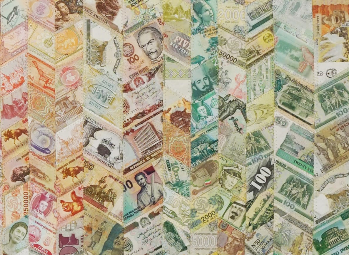 a detail of an artwork made from discontinued currency notes that have been deconstructed and reassembled into a chevron pattern