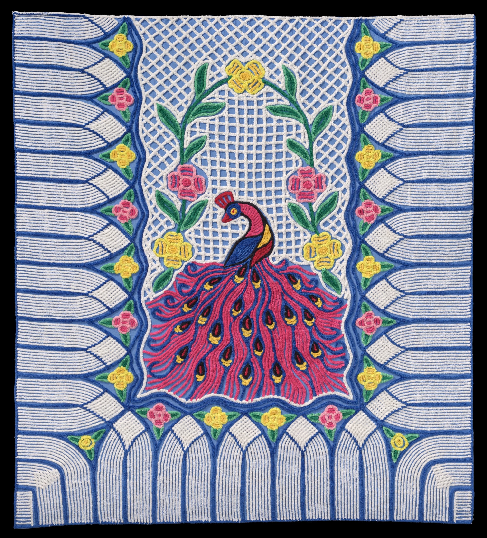 a chenille blanket with a peacock and flowers