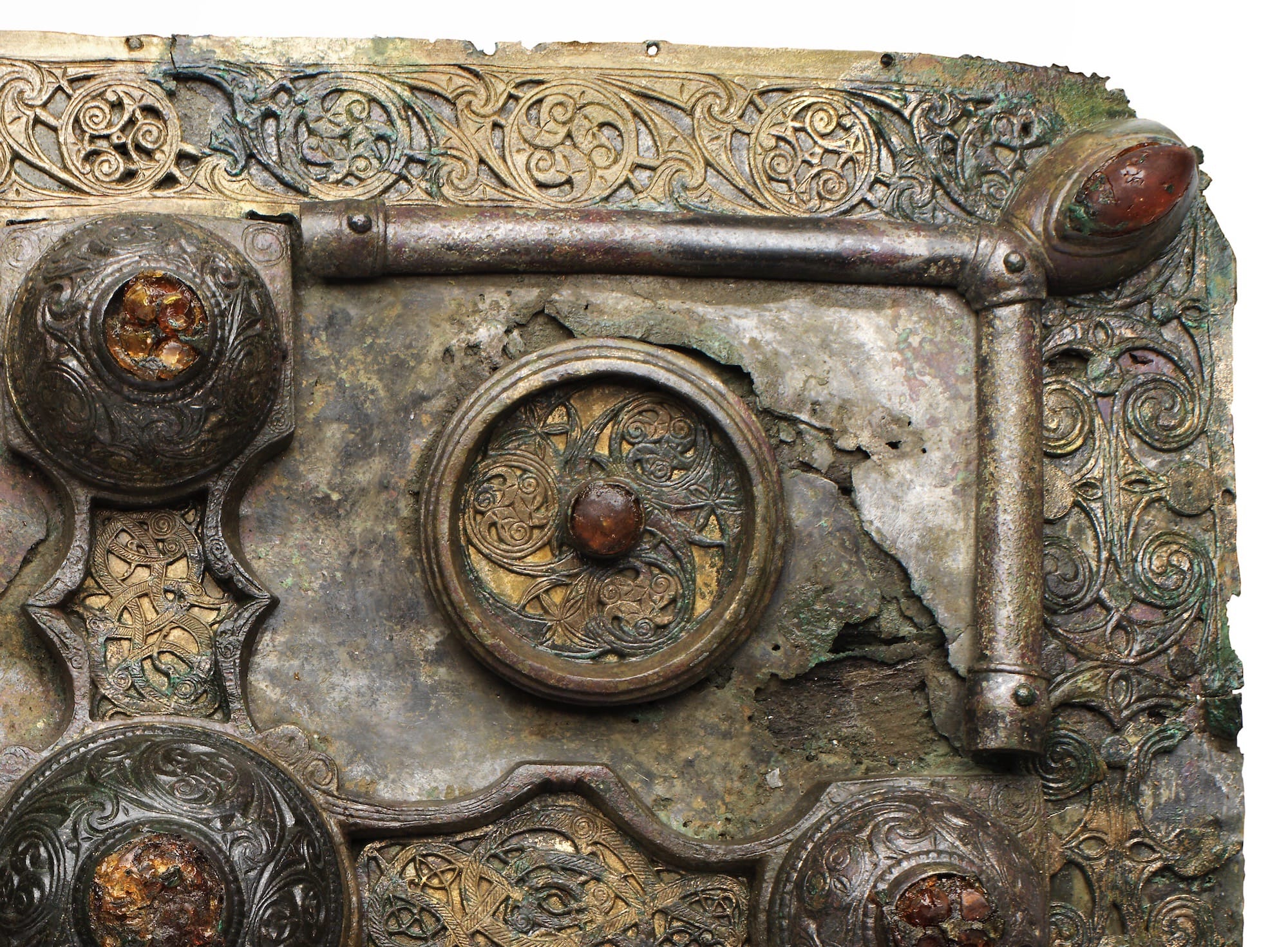 a detail of a highly decorated medieval metal book shrine