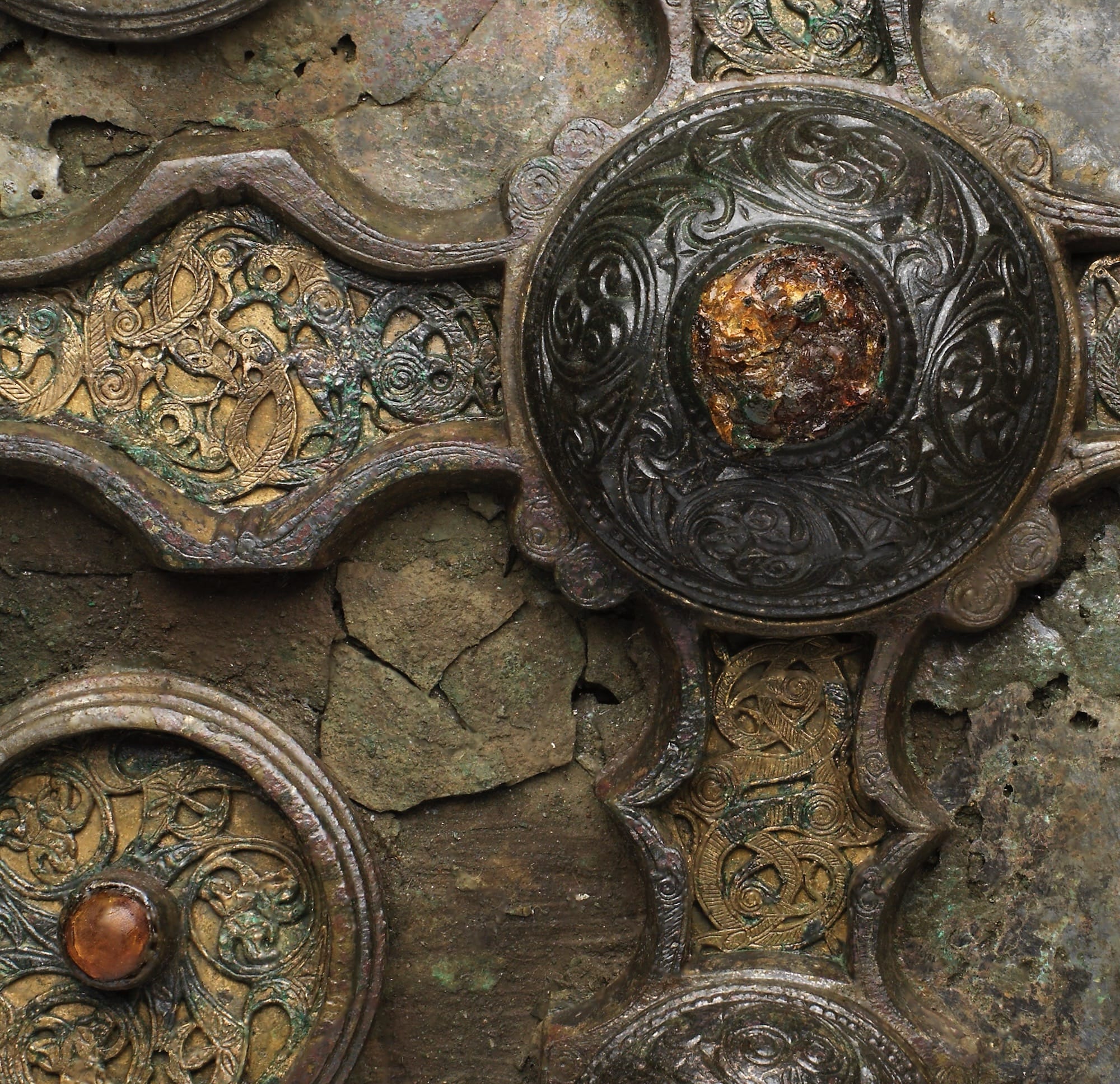 a detail of a highly decorated medieval metal book shrine