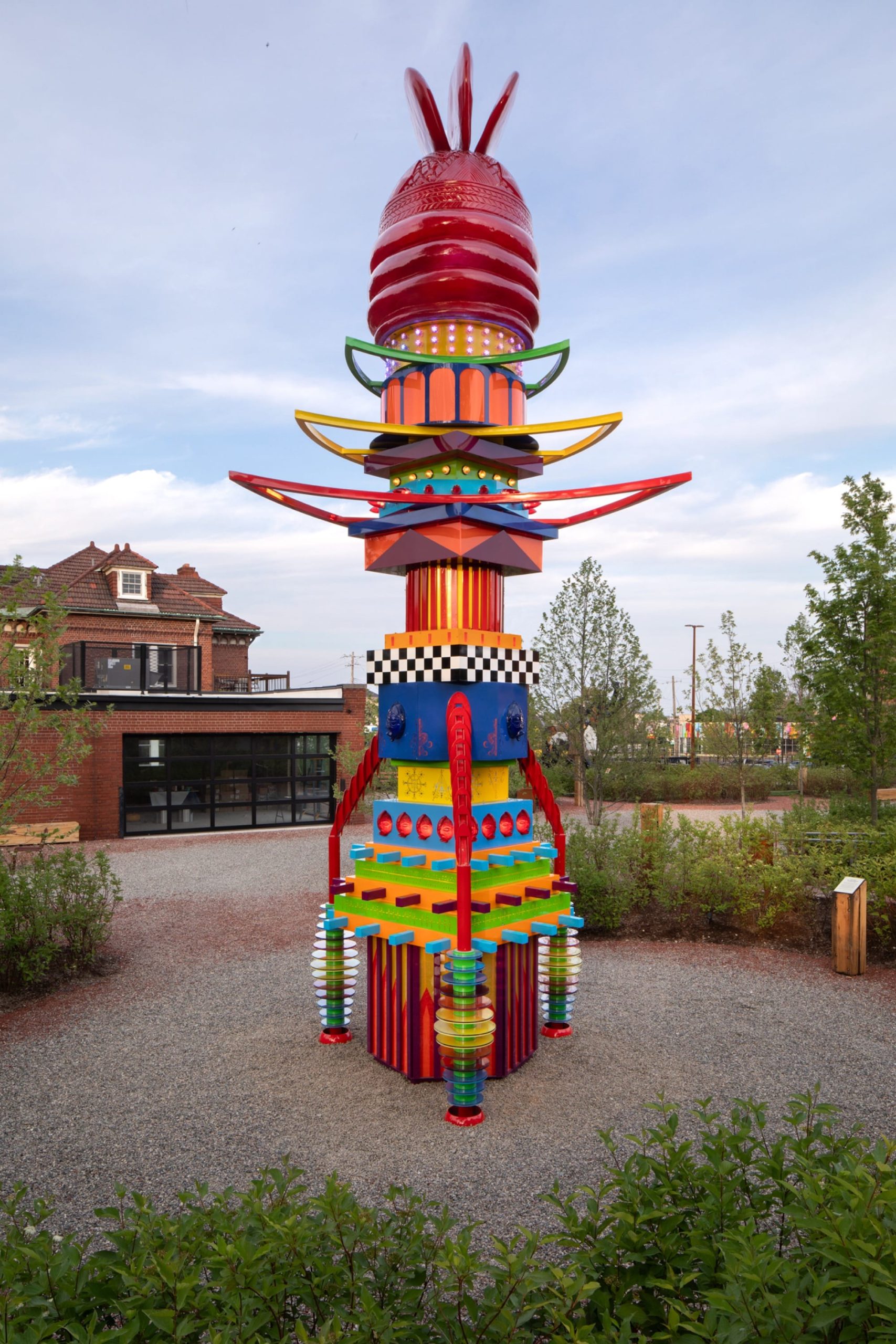 a vibrant, tall, totem-like sculpture