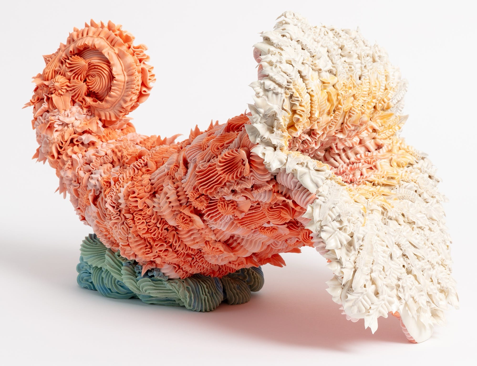 a colorful, ceramic cornucopia made with clay piped like frosting