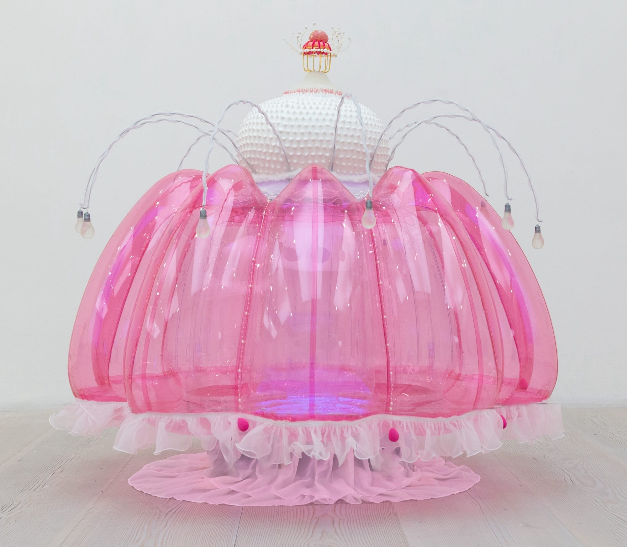 an abstract inflatable artwork that resembles a pink, alien-like creature