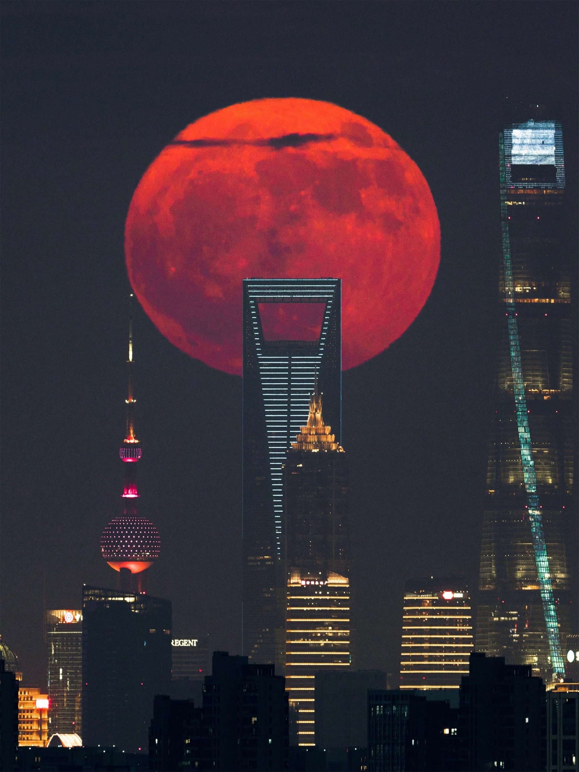 a blood moon rising over Shanghai